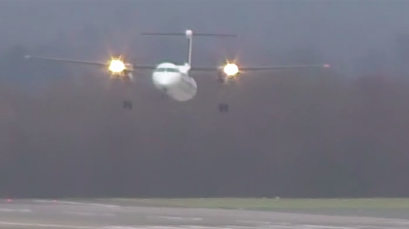 Turboprop plane buffeted by gusts of wind in harrowing landing