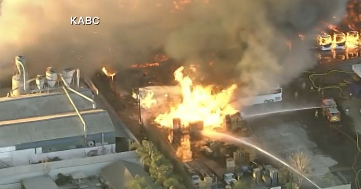 Massive fire burns in industrial area of Compton